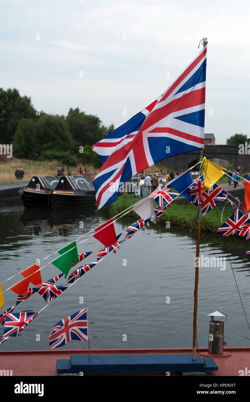 A Union flag and bunting on board a narrowboat at the Inland Waterways Association Pelsall Canal Festival at the Wyrley and Essington Canal 2016 Stock Photo
