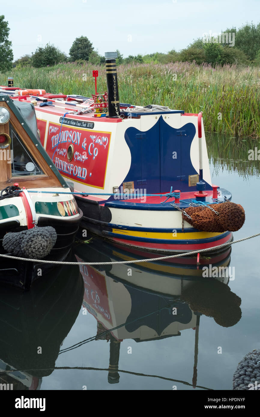 Narrowboats reflected in the Wyrley and Essington Canal at the Inland Watrerways Association Pelsall Canal Festival 2016 Stock Photo