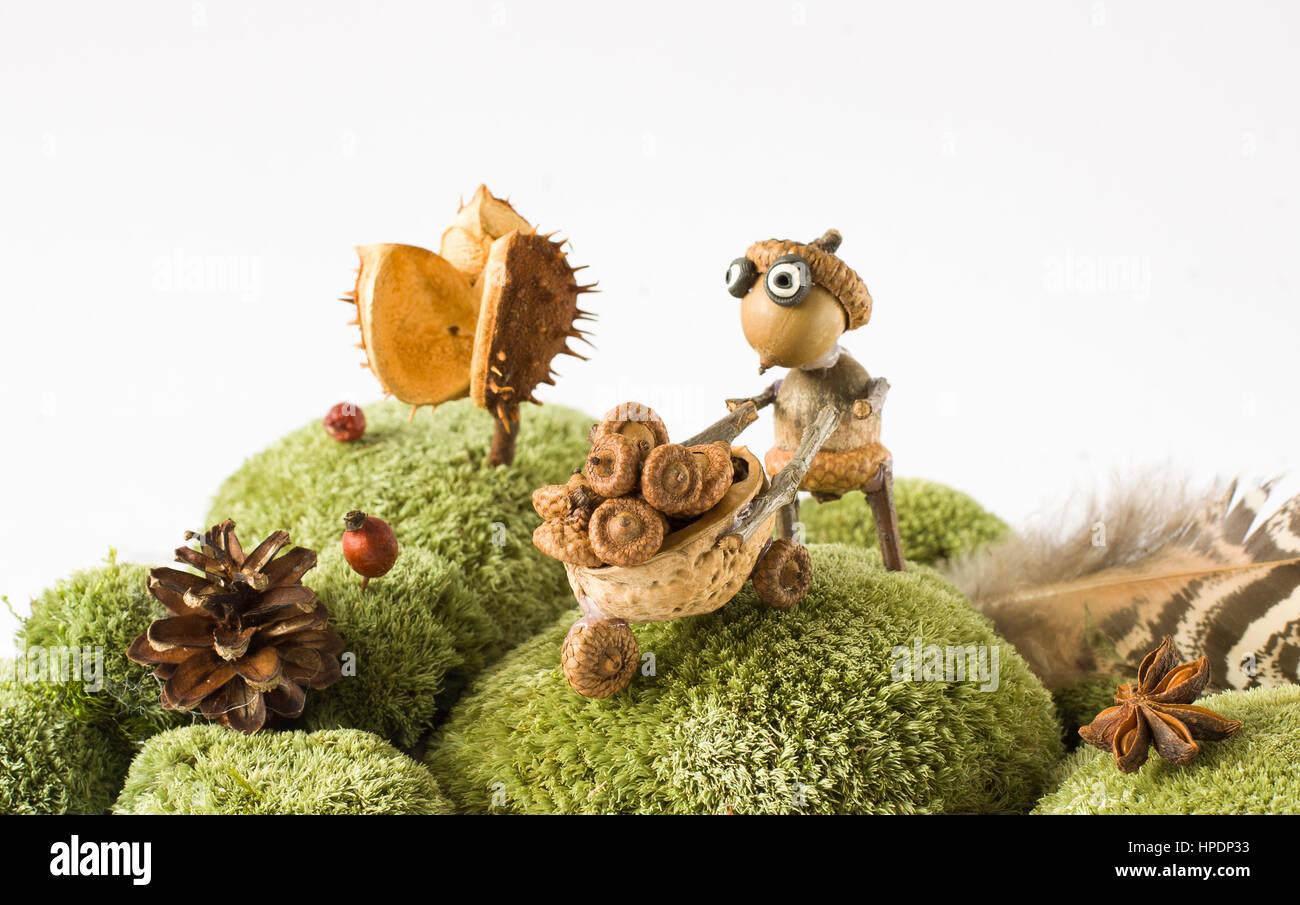 tree sprite collecting accorns autumn season Stock Photo - Alamy