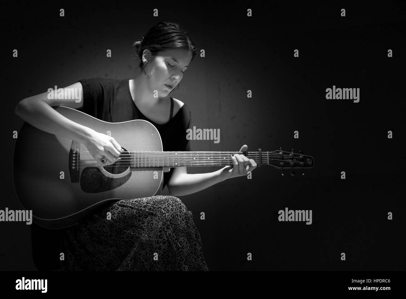 Concert ISEO- A Spanish girl Album Last Night in acoustic playing in Corte  Ingles in Madrid - Spain. Only guitar Stock Photo - Alamy