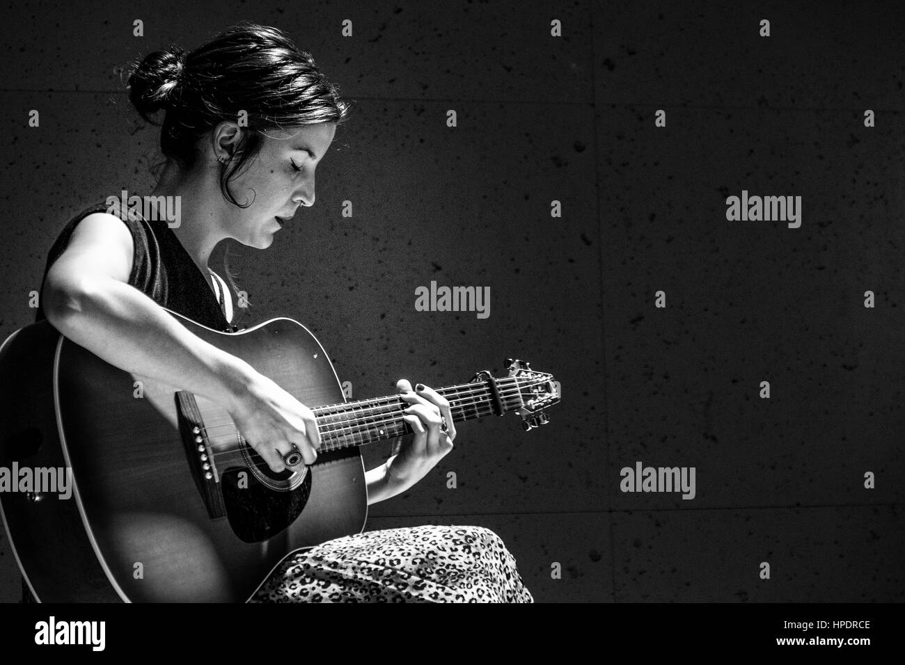 Concert ISEO- A Spanish girl Album Last Night in acoustic playing in Corte  Ingles in Madrid - Spain. Only guitar Stock Photo - Alamy