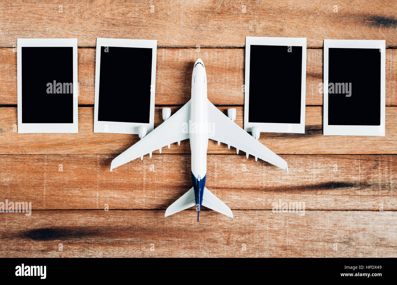 Preparation for Traveling concept , Airplane with photo frame, on a