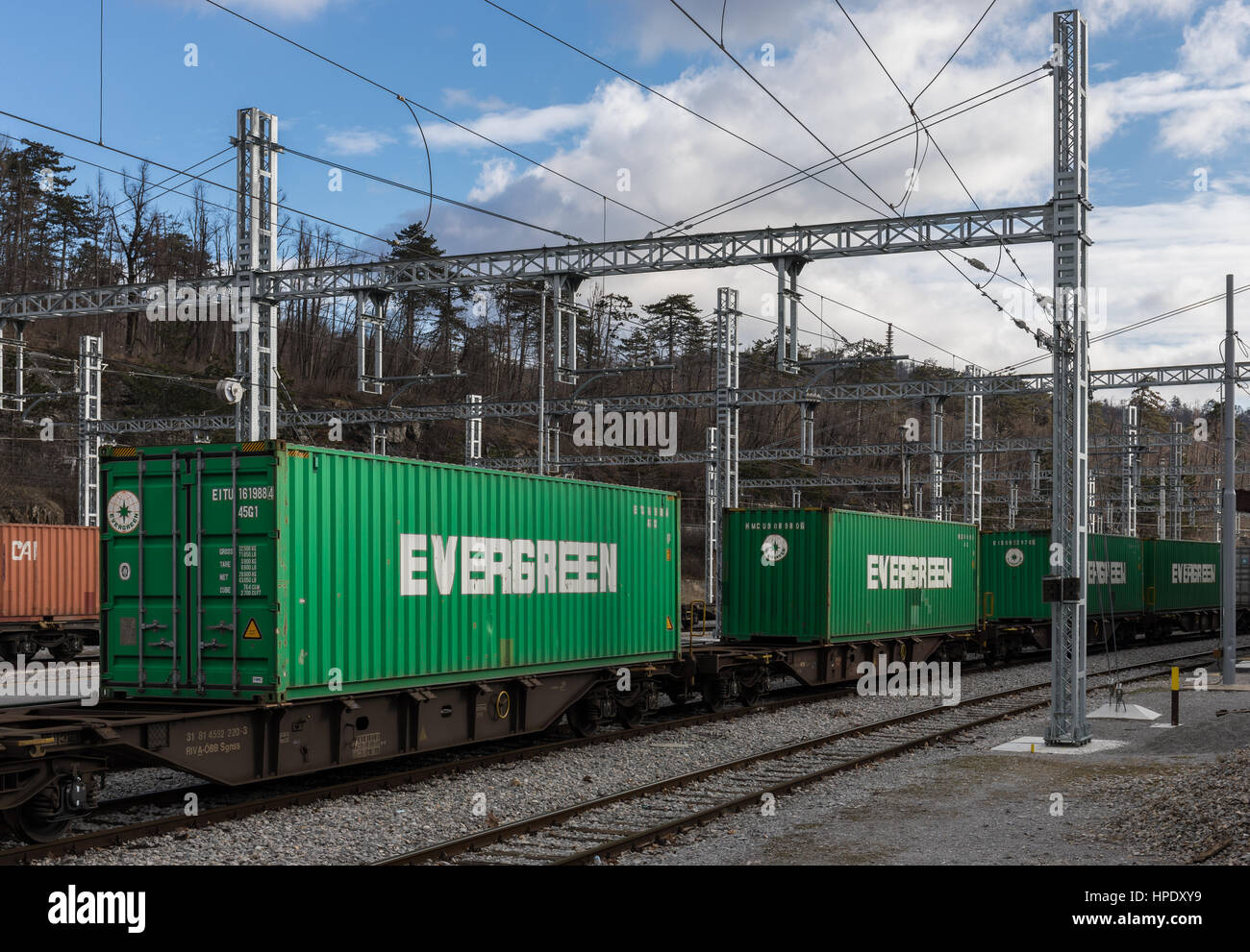Freight train on railroad loaded with Evergreen cargo containers Stock