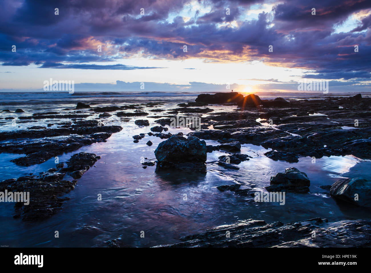 stormy sunset over a rocky beach, Hendrys Beach, Santa Barbara, California Stock Photo