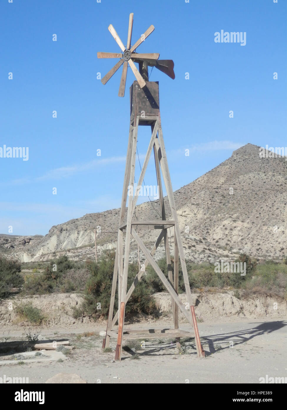 Wooden Wind Mill in Fort Bravo Film Set, Tabernas Desert, Almeria, Spain Stock Photo