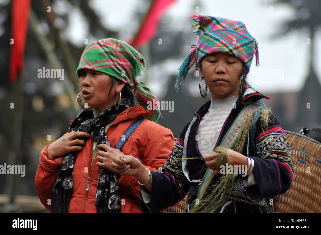 SAPA, VIETNAM - FEBRUARY 22, 2013: Hmong women at Bac Ha market in Northern Vietnam. Bac Ha is hilltribe market where people come to trade for goods i Stock Photo