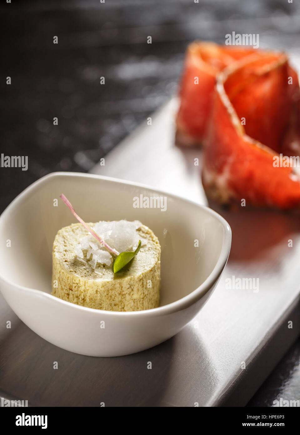 Compound butter with prosciutto served on restaurant table Stock Photo