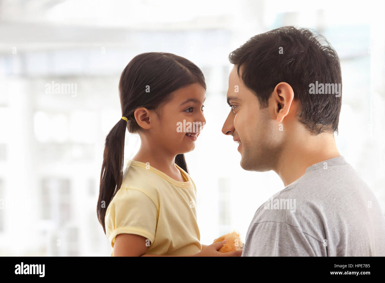 Close up of daughter and father face to face Stock Photo
