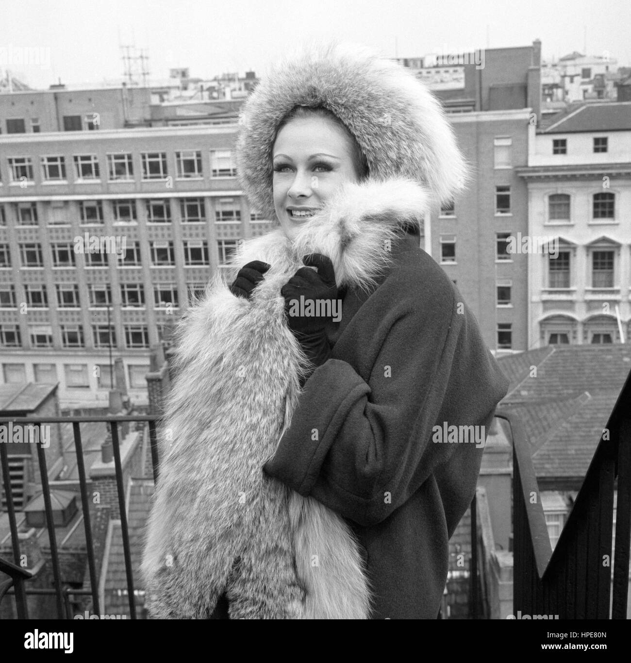 Aldine Honey from South Africa models a three-quarter length angora coat trimmed with lynx fur and matching hat during rehearsals in London for the Fifth London Fashion Week, opening tomorrow. Stock Photo