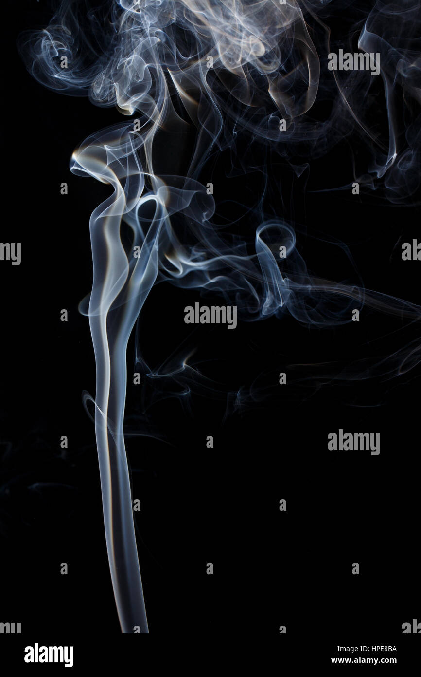 Abstract art. Color white blue smoke from the aromatic sticks on a