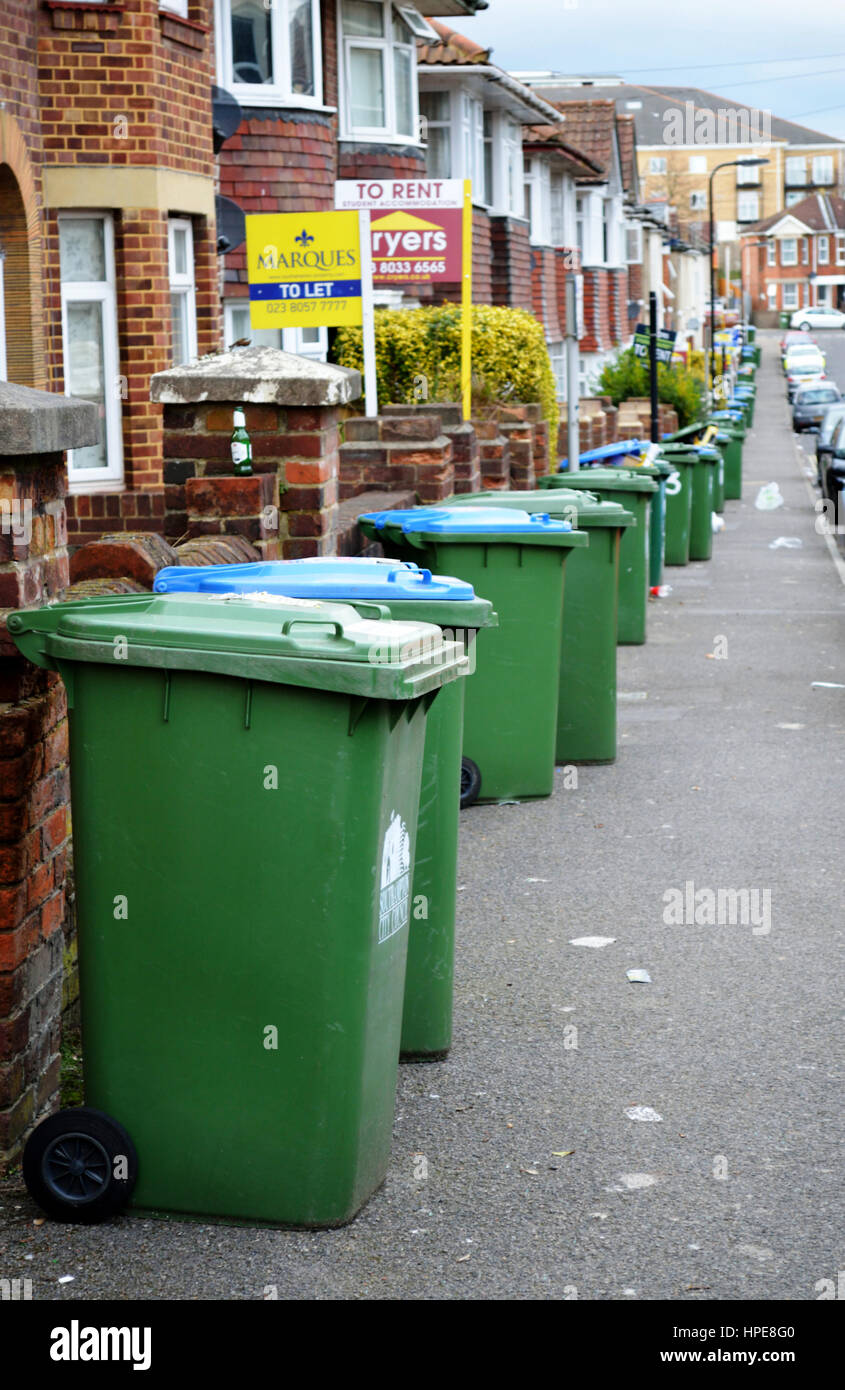 Row of green wheelie bins ready for rubbish collection Stock Photo Alamy