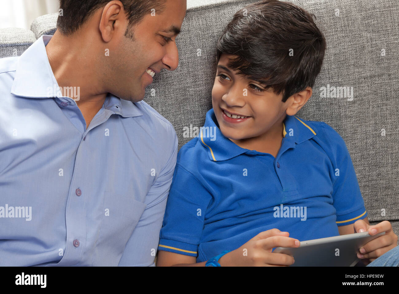 Smiling father holding son hi-res stock photography and images - Alamy
