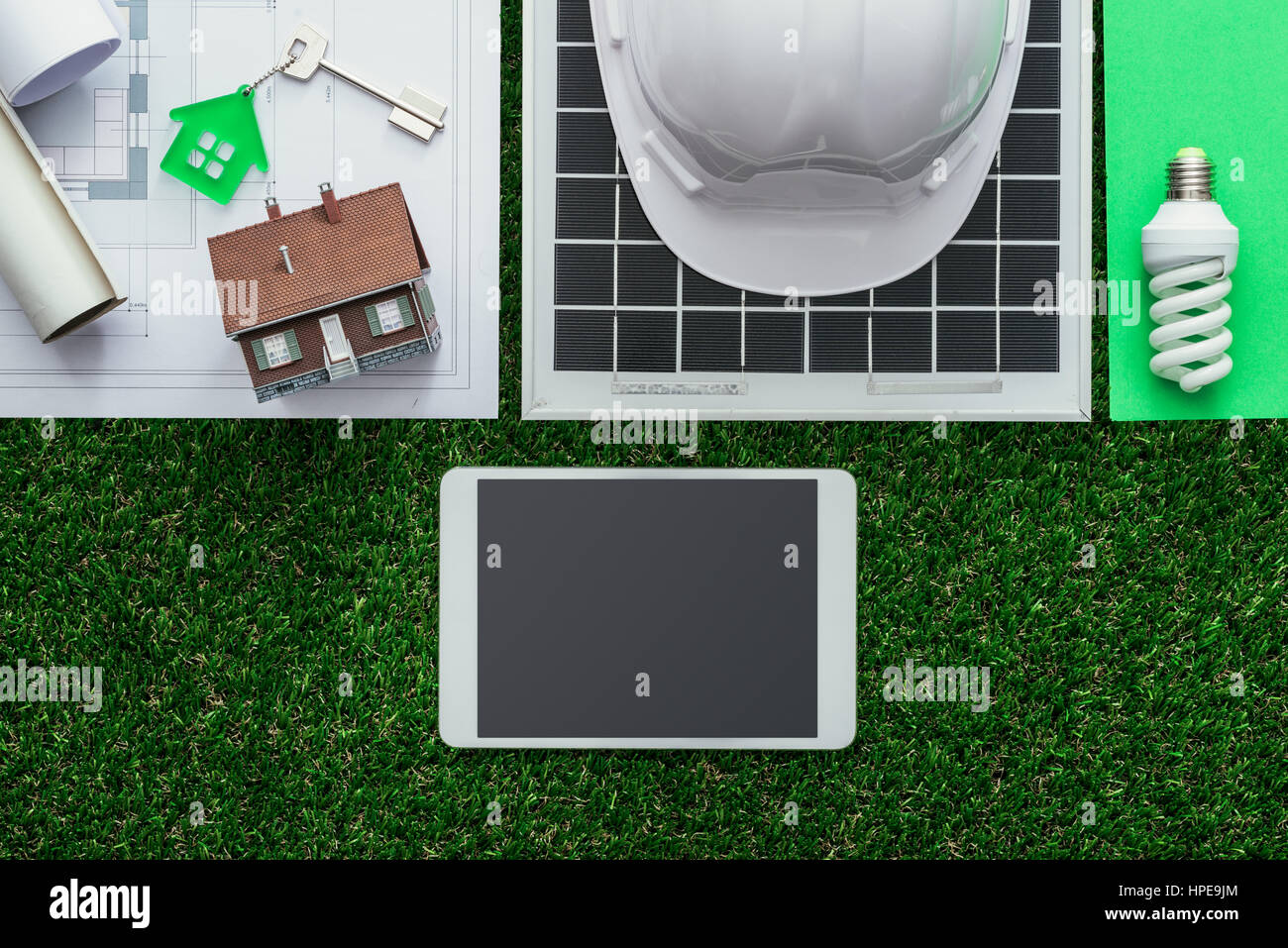 Eco house and sustainable building concept: work tools, solar panel and ...