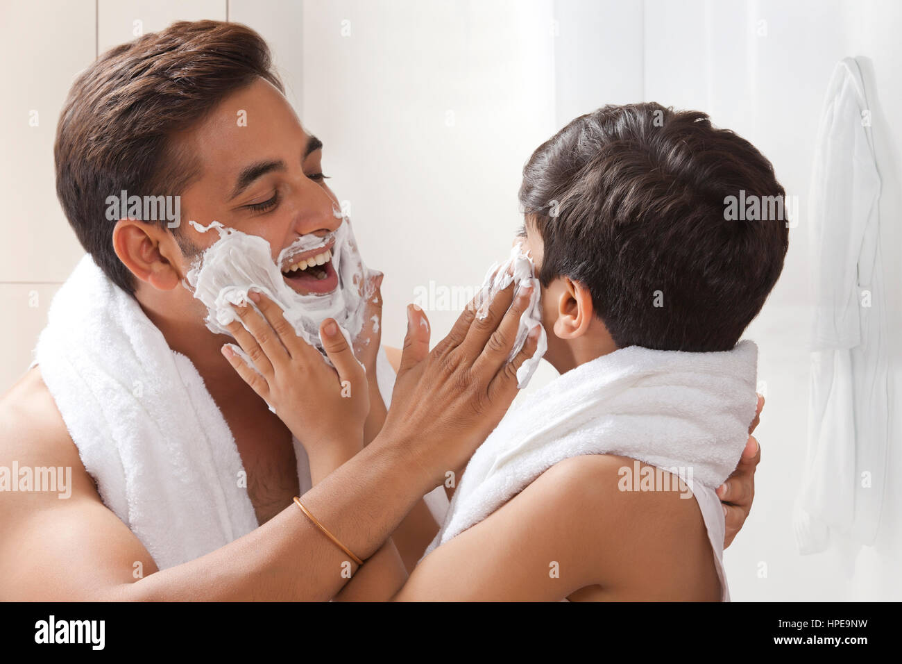 Father and son acting as super heroes Stock Photo