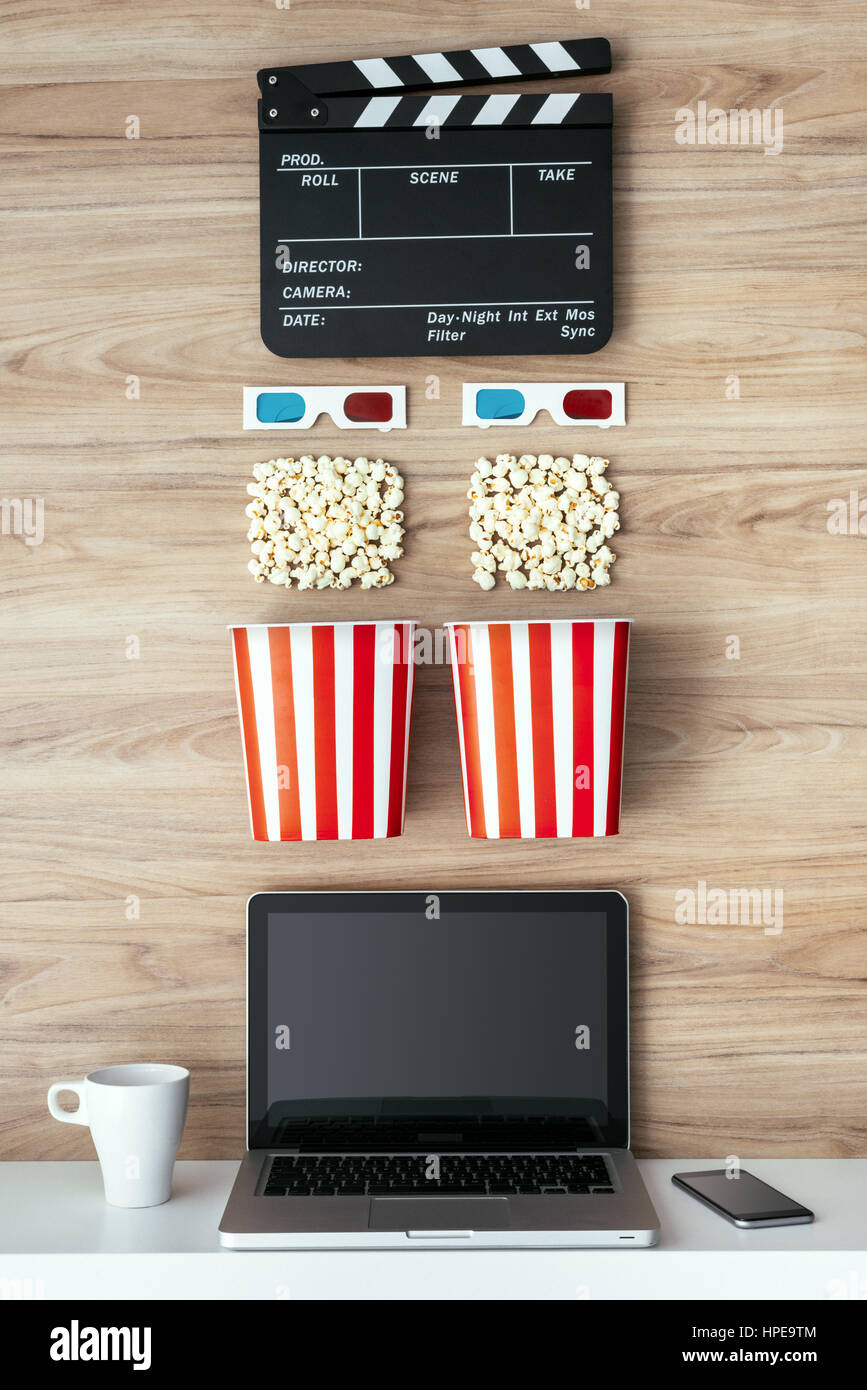 Computer Screen With Popcorn Laptop, popcorn, 3D glasses and clapboard on a wooden surface, cinema ...
