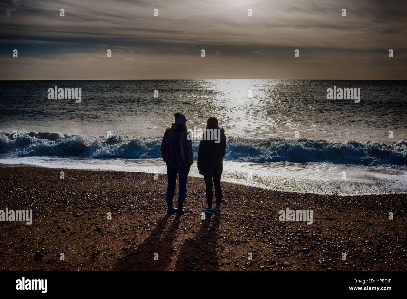 Woman looking out to sea Stock Photo Alamy