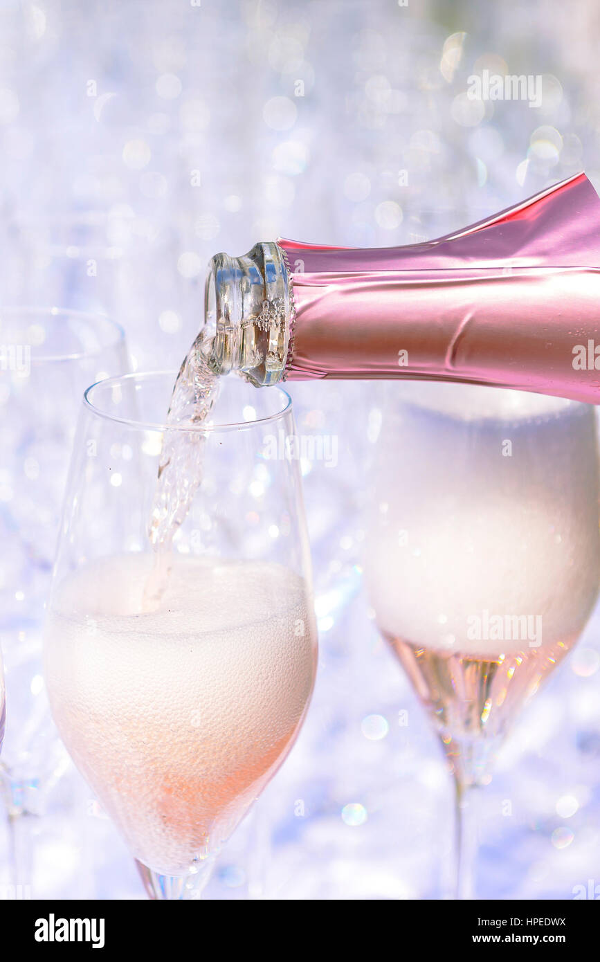 Rose champagne sparkling wine in glasses; catering at reception Stock
