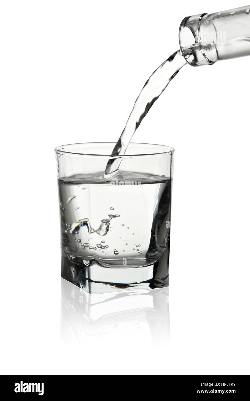 Water pouring out of bottle with its reflection isolated on white