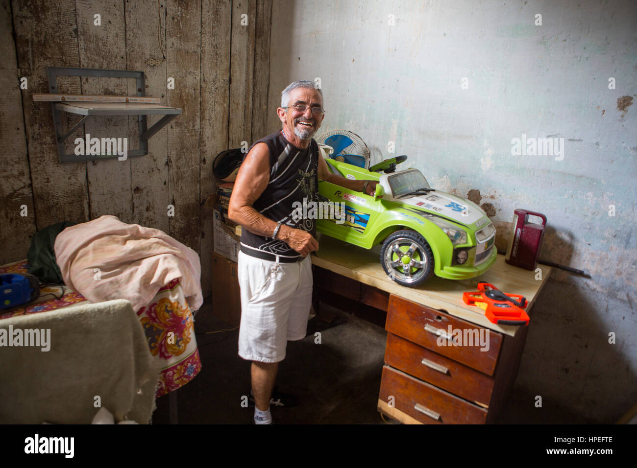 Portrait of transgender man Juani Santos (64) at home in his hometown Matanzas, Cuba. Juani was born as a woman, but he knew he was a boy since he was Stock Photo