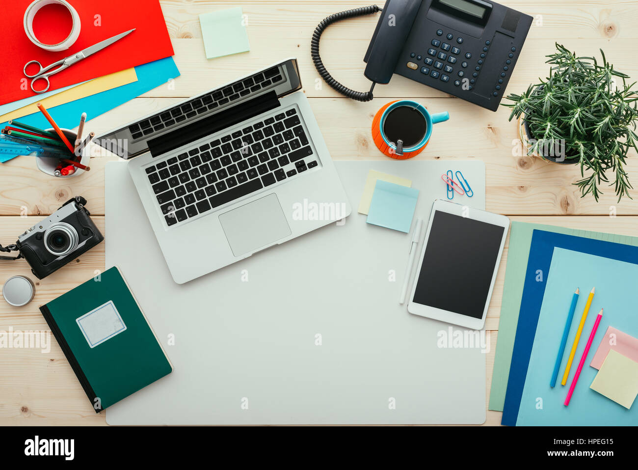 Creative contemporary desktop with laptop, digital tablet, camera and  office supplies, flat lay banner with copy space Stock Photo - Alamy