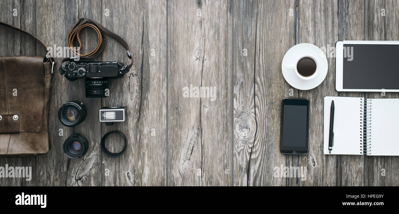 Hipster freelance photography equipment, camera and touch screen devices on  a wooden desktop, flat lay banner with copy space Stock Photo - Alamy