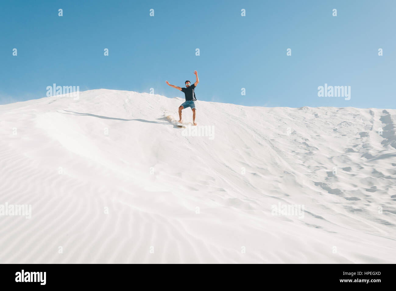 Sand boarding crash at the Lancelin sand dunes near Perth, Western Australia Stock Photo