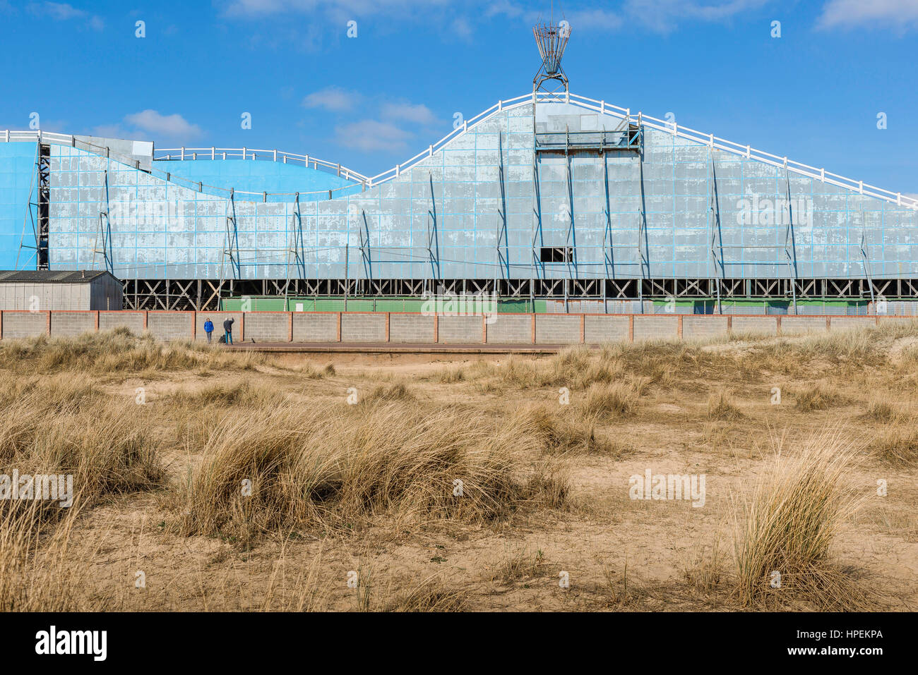 Norfolk coast UK, a view across the sand dunes towards the rear of the roller-coaster ride at Great Yarmouth, UK. Stock Photo
