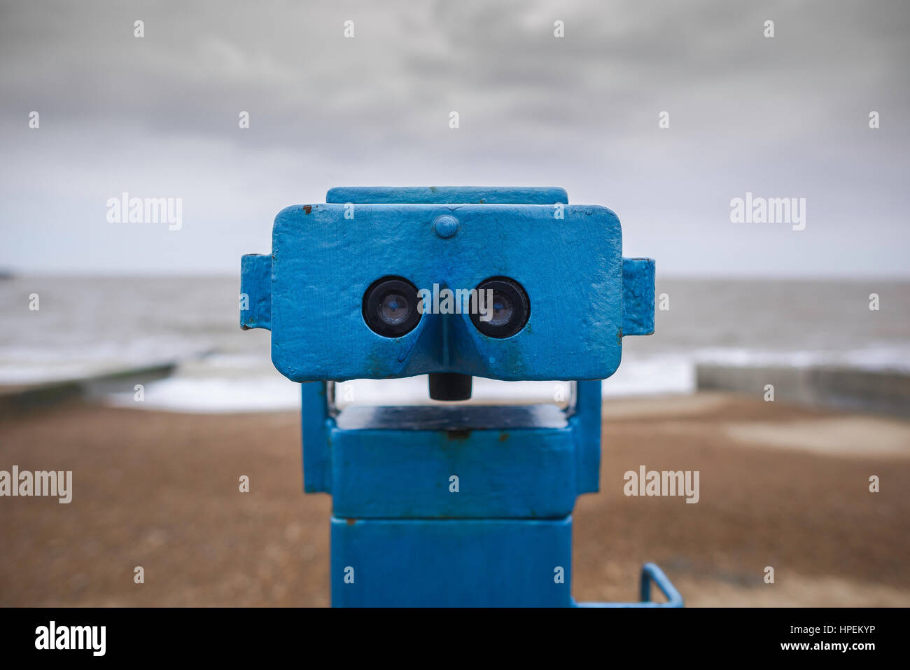 UK seaside, out of season view of a set of seaside viewing binoculars on Felixstowe beach, Suffolk, UK. Stock Photo