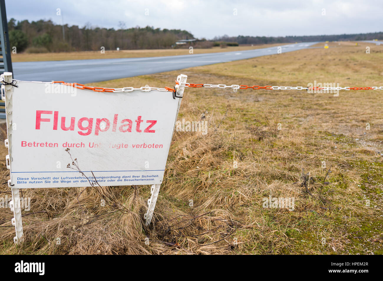End of runway 29 at Bielefeld-Senne airport, Germany with Flugplatz sign Stock Photo