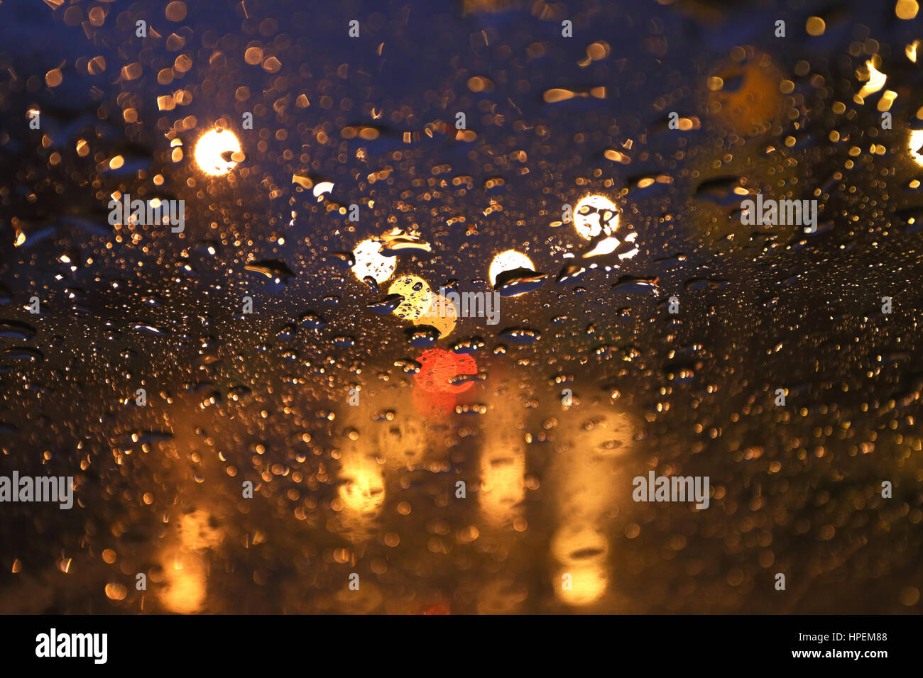 street blurred rain background view through wet car window Stock Photo
