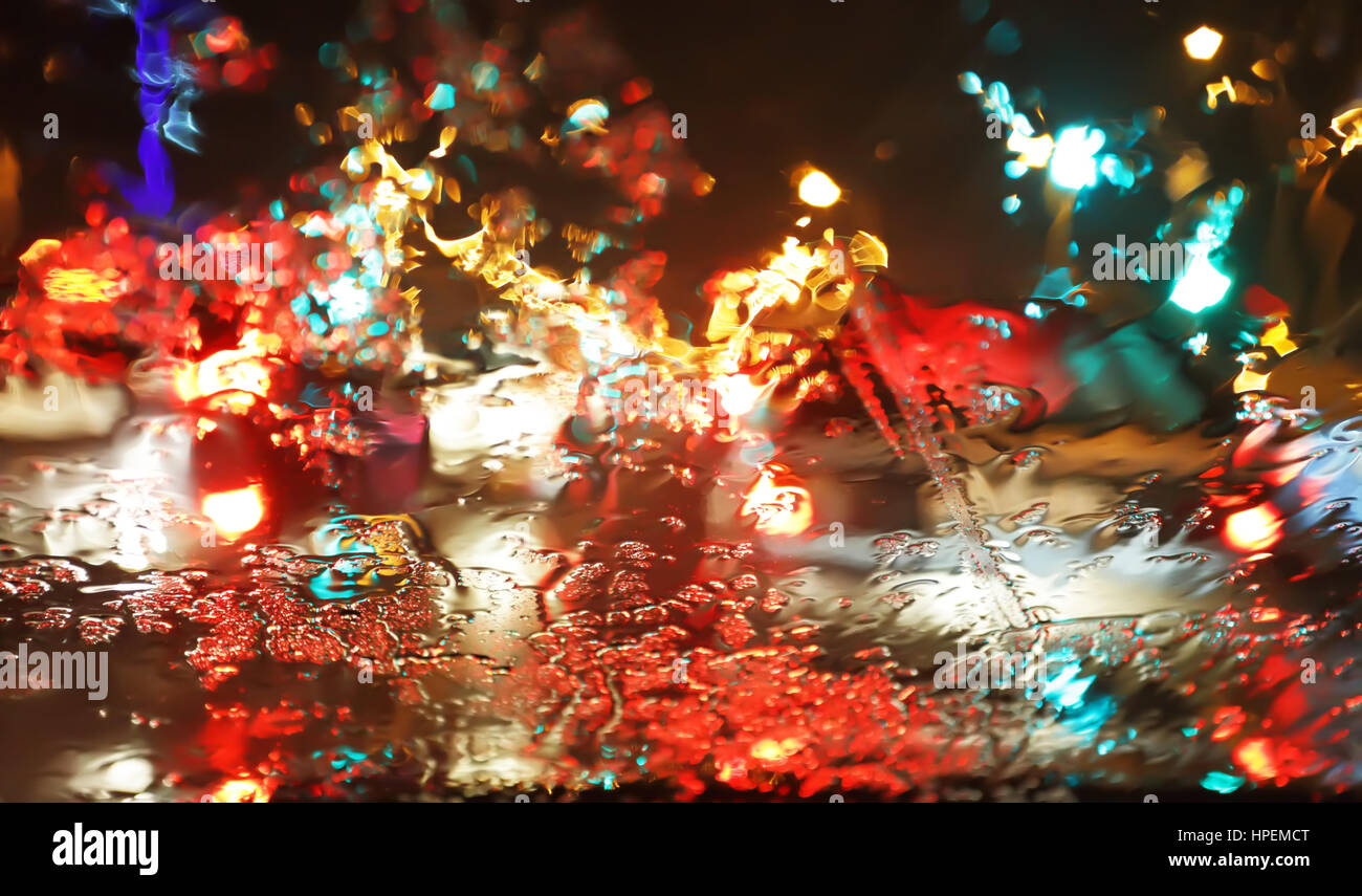 Blurred rain background view through wet car window Stock Photo