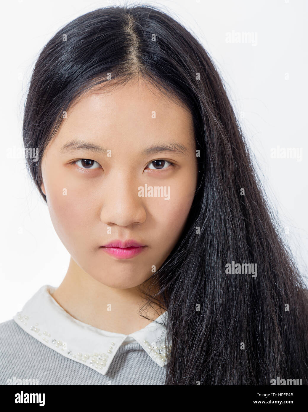 Portrait of serious looking Chinese teenage girl Stock Photo Alamy
