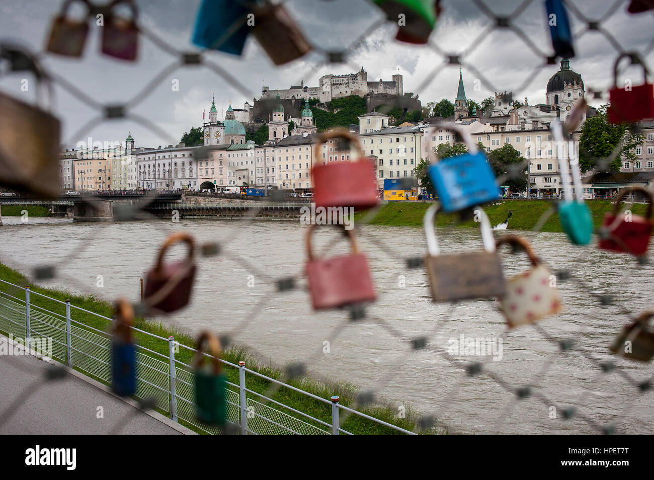 Panoramic view of Salzburg castle and Old Town, through symbolic love padlocks fixed to the railings of Makartsteg footbridge, Salzburg, Austria Stock Photo