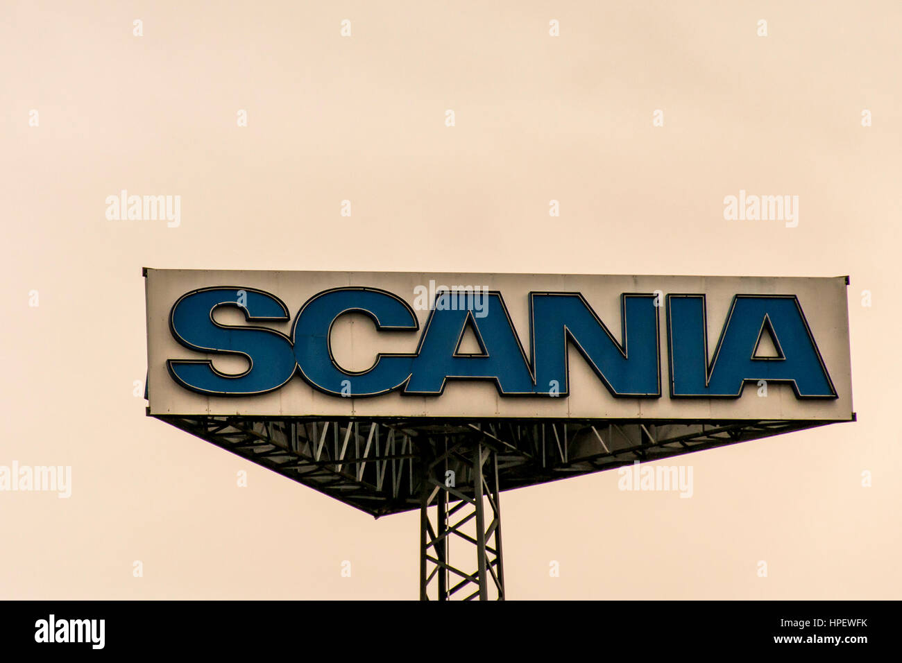 Koblenz, Germany - 20.02.2017 : Sign tower Scania trucks Logo against cloudy sky sunset at german service headquater Stock Photo