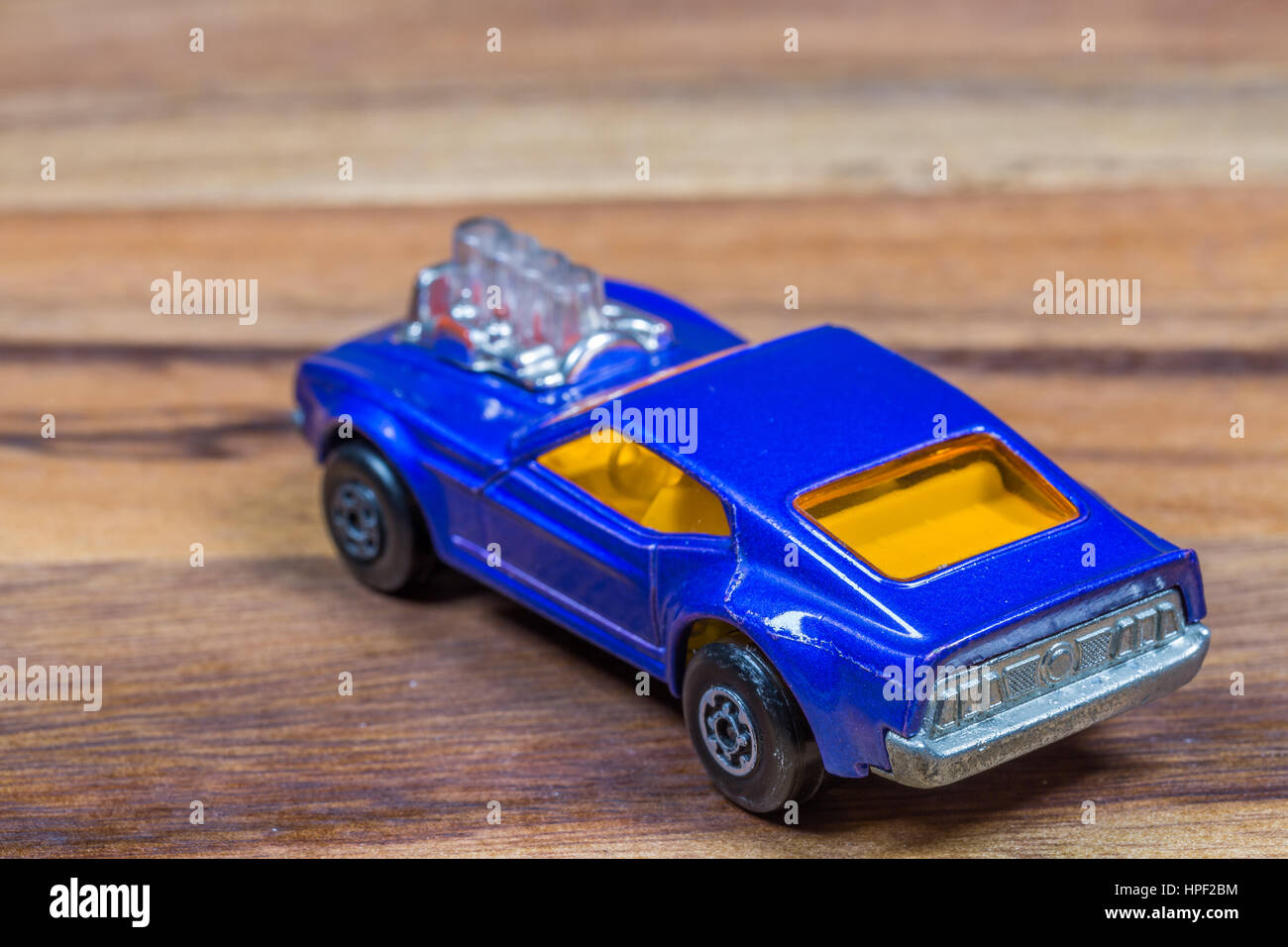 Old toy car on wooden background Stock Photo Alamy