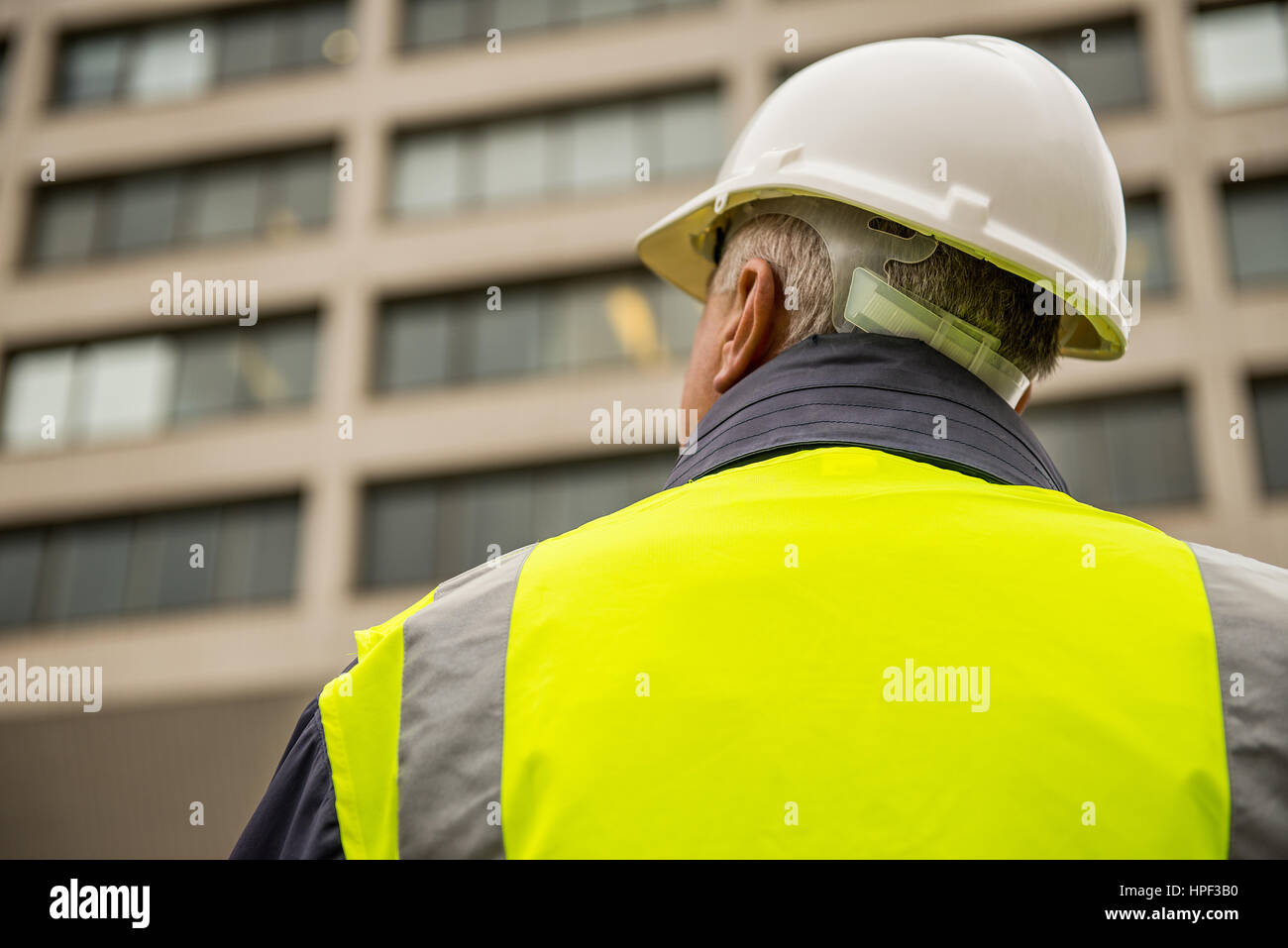 Building inspector with his back to the camera. Stock Photo