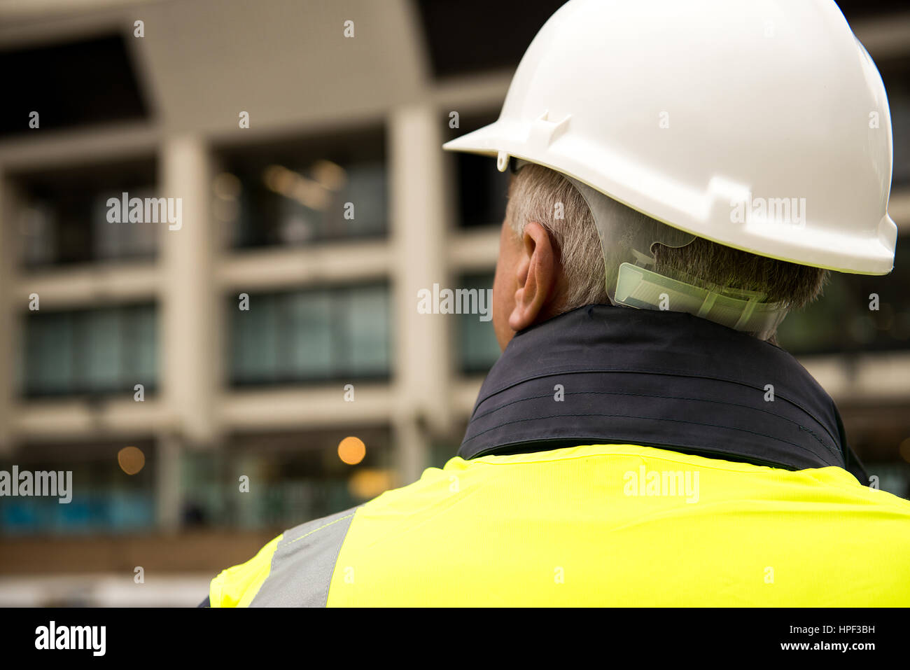Building inspector with his back to the camera. Stock Photo