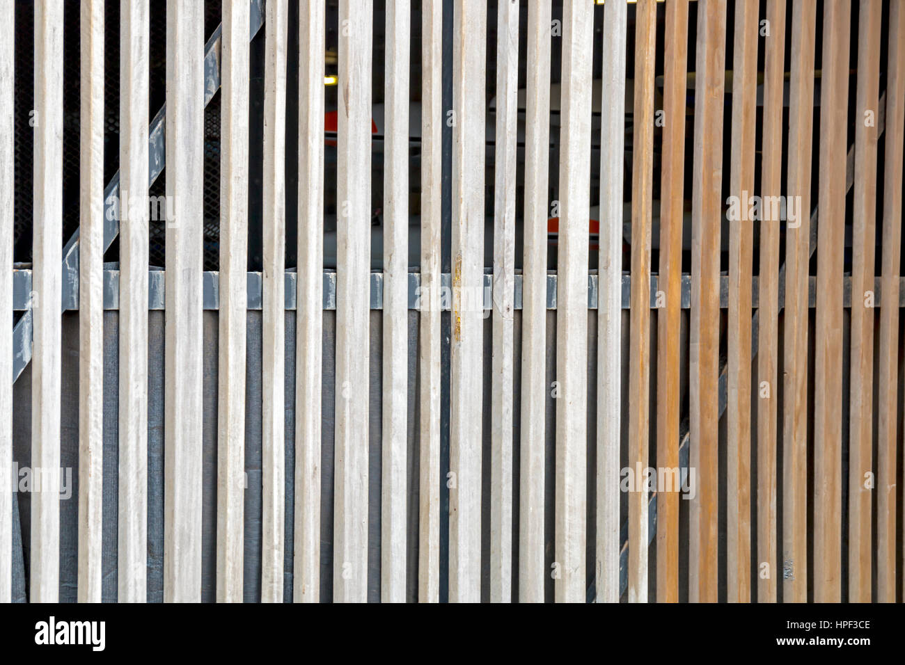 Close-up of pattern and texture and verticle planks of slatted wooden gate barrier Stock Photo