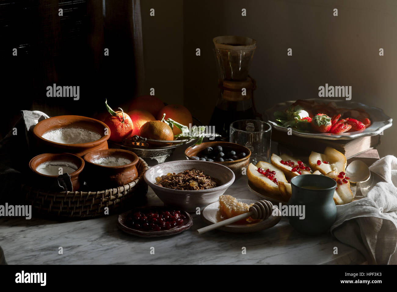 Homemade muesli breakfast with honey, greek yoghurt, and fruits Stock