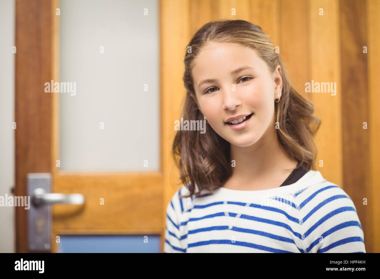 Portrait of smiling schoolgirl in school Stock Photo - Alamy