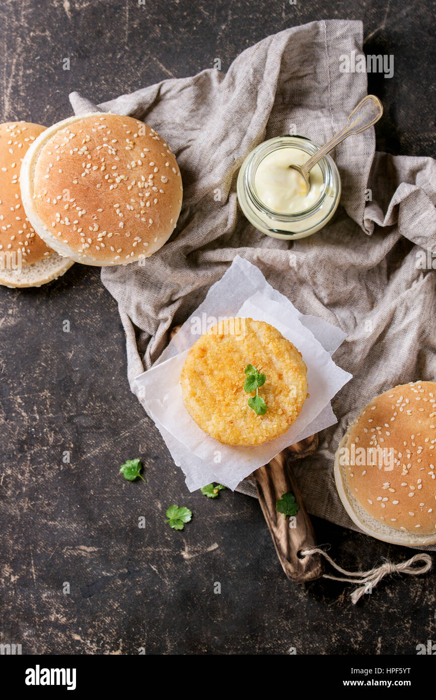 Ingredients for making vegan burger. Veggie cheese and onion cutlets