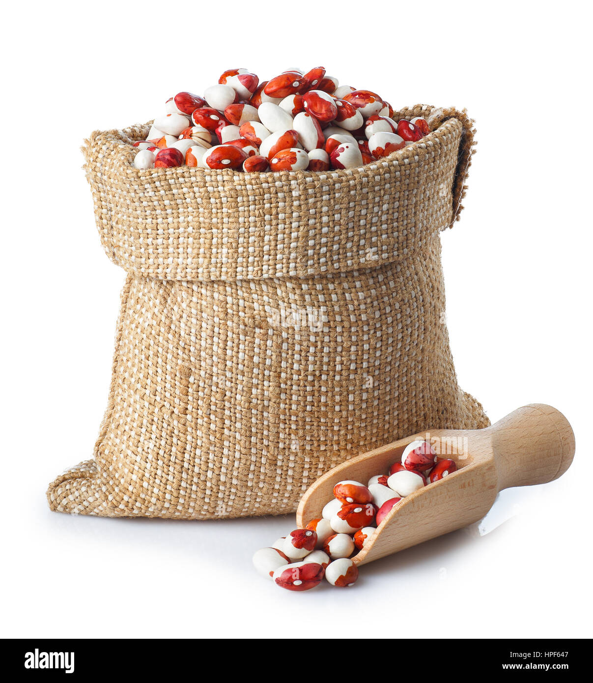uncooked kidney beans in burlap sack with wooden scoop isolated on