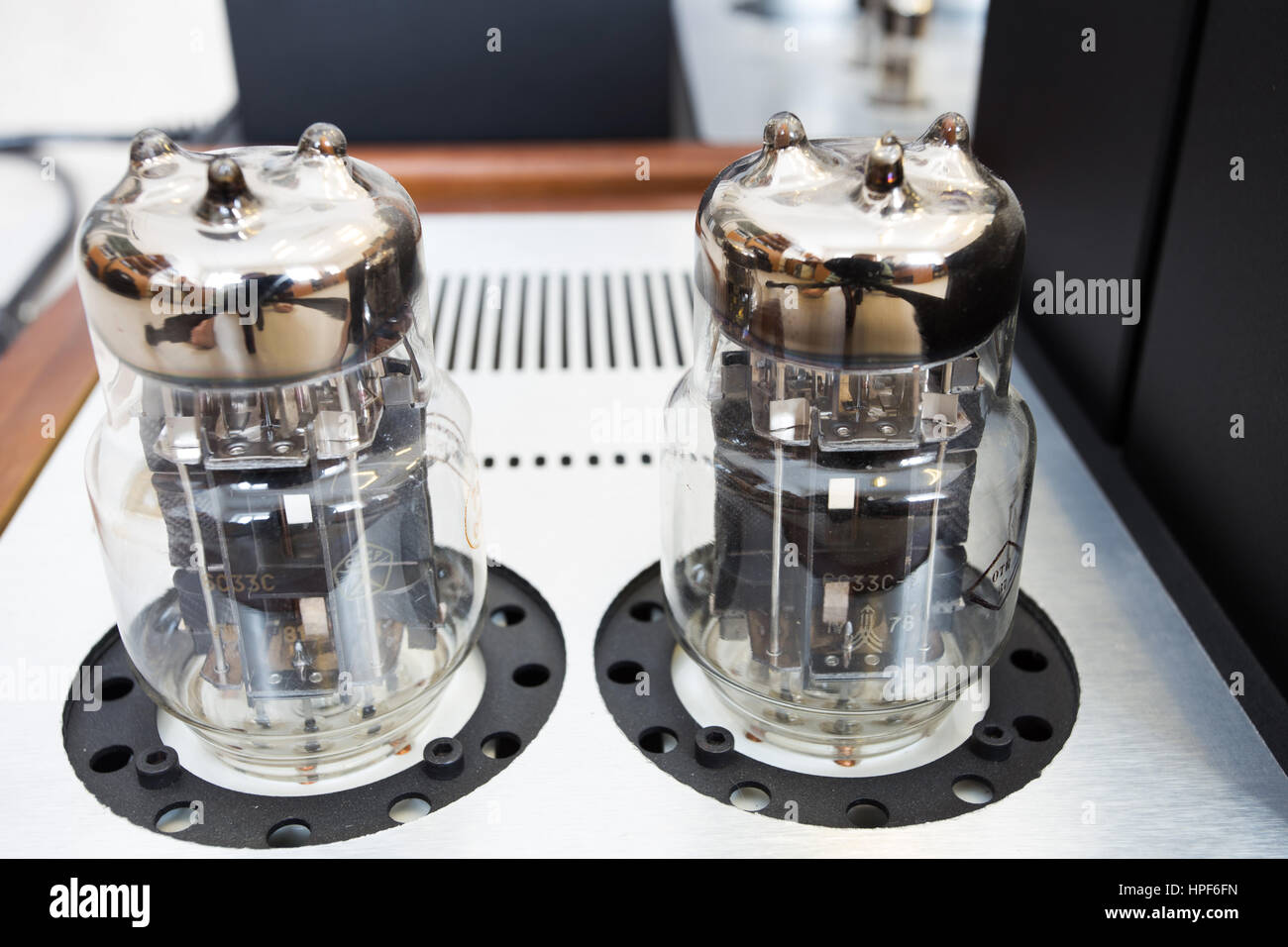 Vintage retro music amplifier with glass lamps on top Stock Photo