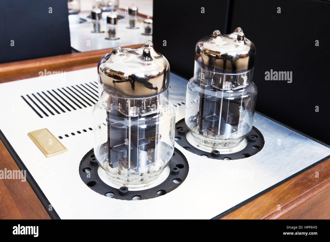 Vintage retro music amplifier with glass lamps Stock Photo