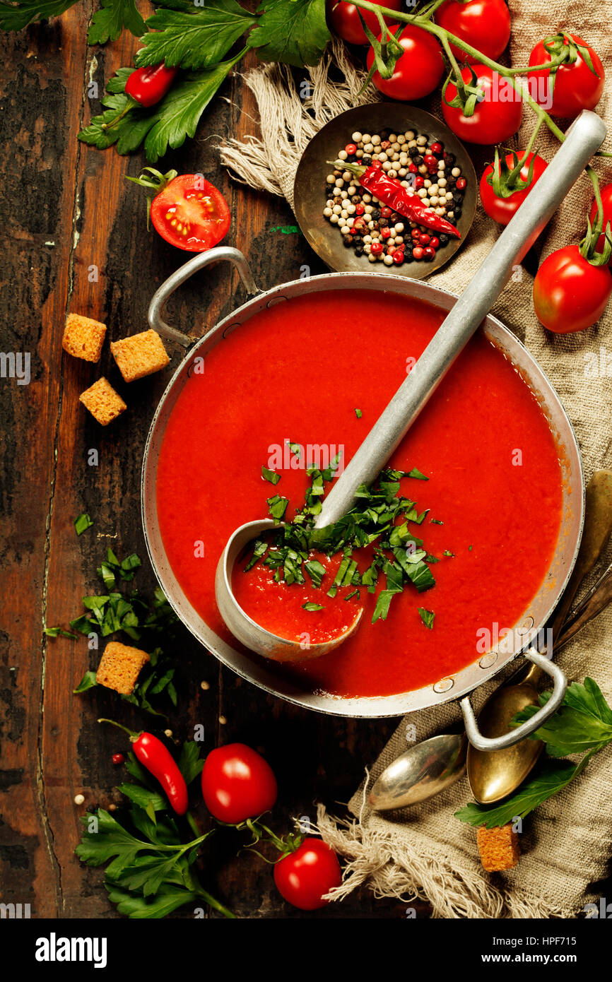 Homemade Tomato soup on wooden table, top view Stock Photo - Alamy