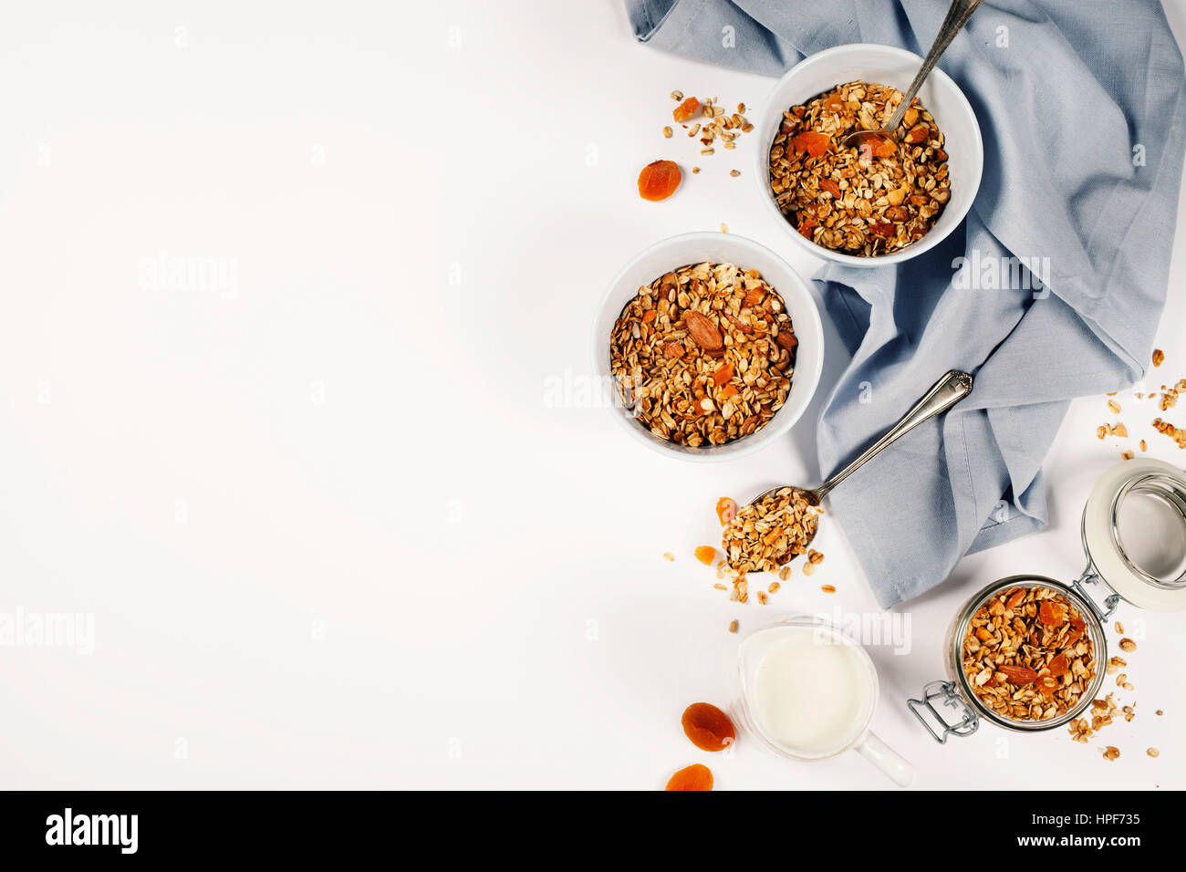 Homemade granola (with dried fruit and nuts) on white background Stock Photo