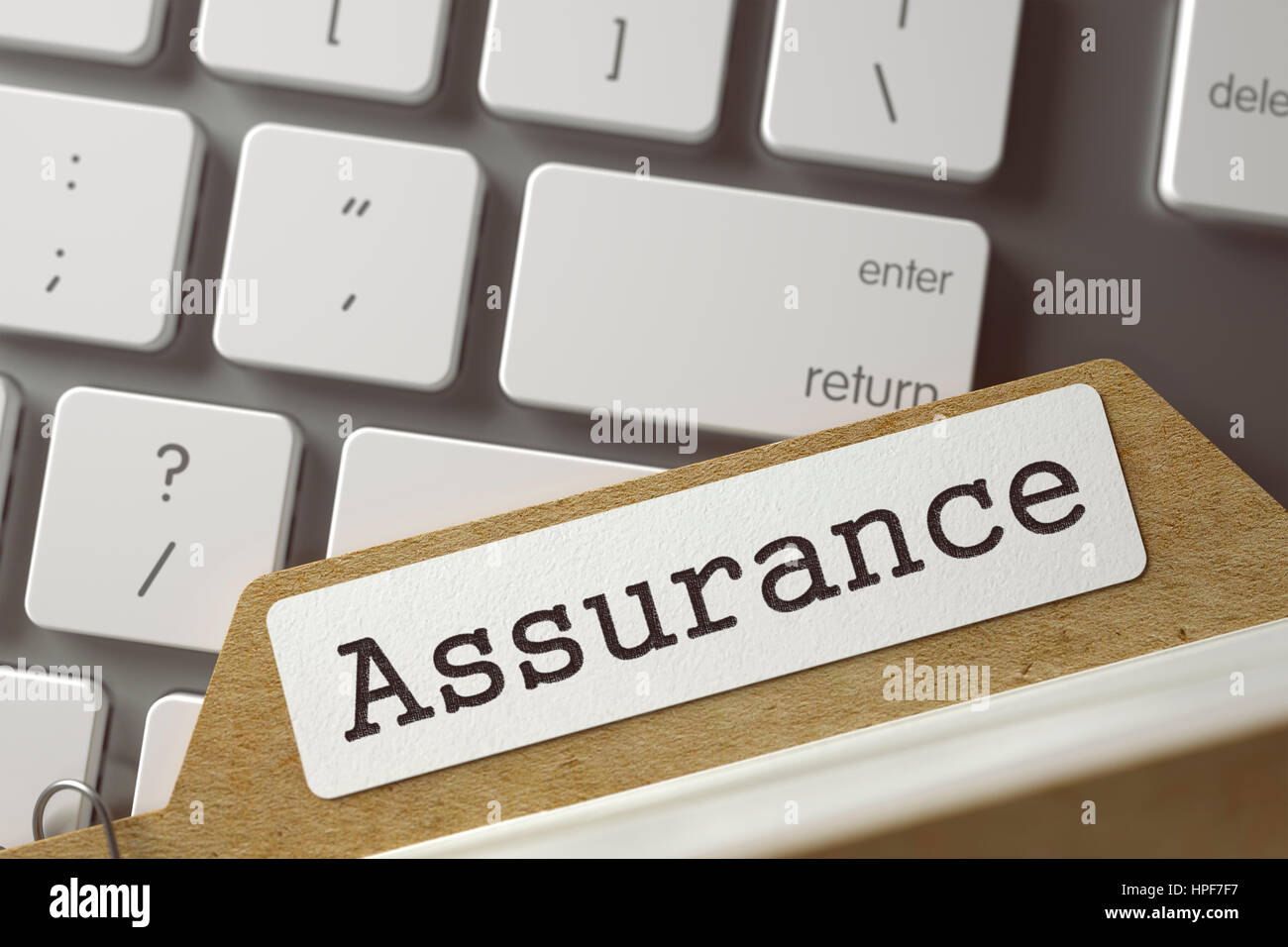 Assurance Concept. Word on Folder Register of Card Index. Folder Register Concept on Background of Computer Keyboard. Closeup View. Toned Blurred  Ill Stock Photo