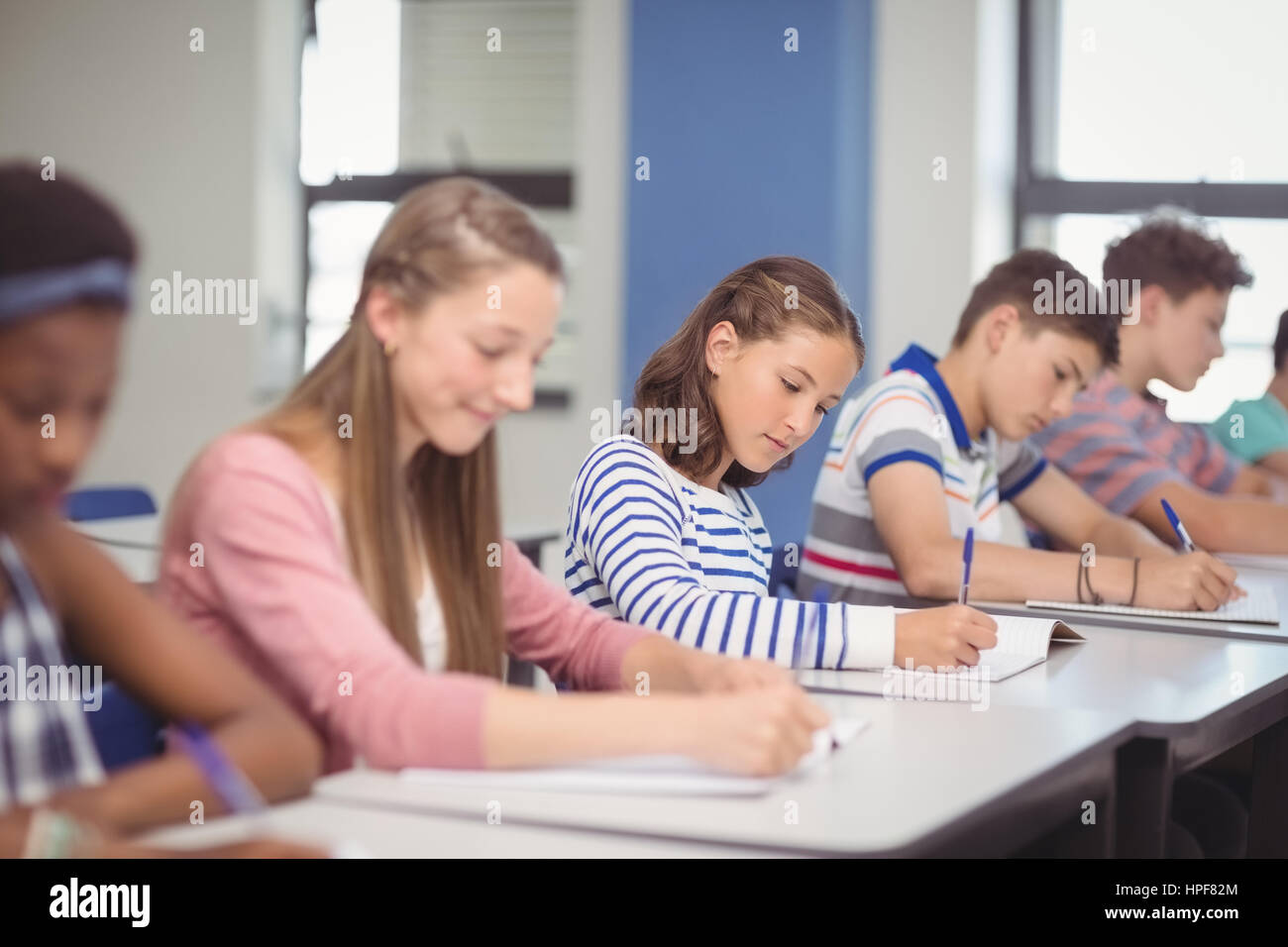 Students studying in classroom at school Stock Photo - Alamy