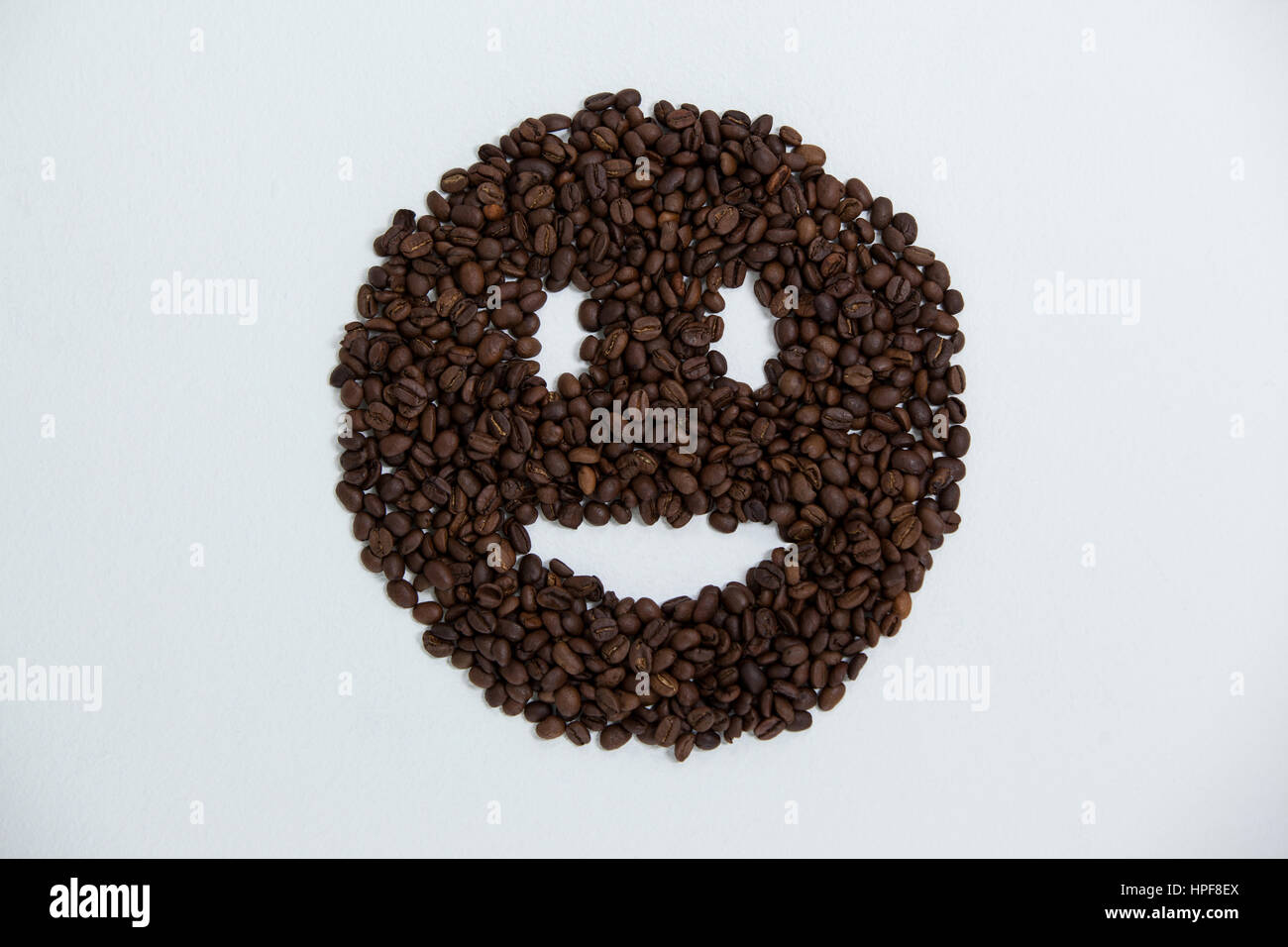 Beans Smiley Coffee beans forming smiley face on white background Stock Photo - Alamy