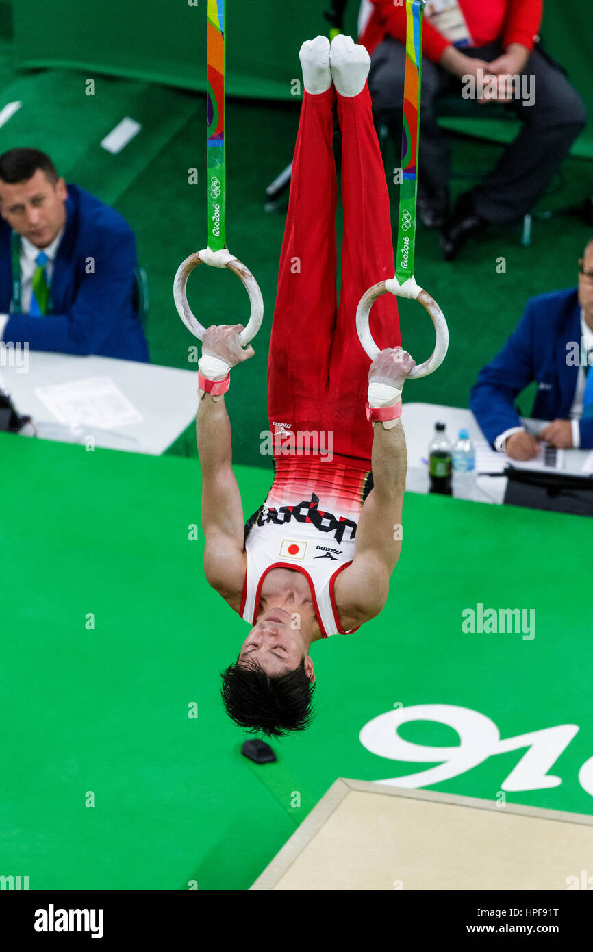Rio de Janeiro, Brazil. 8 August 2016. Kohei Uchimura (JPN) preforms on the Rings as part of the Gold medal winning Men's Gymnastics Team  at the 2016 Stock Photo